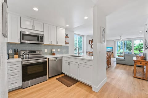 Beautiful open-concept unit featuring new can lights that provide ample lighting throughout