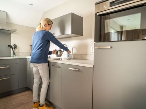 Fridge, stovetop, dishwasher, coffee/tea maker