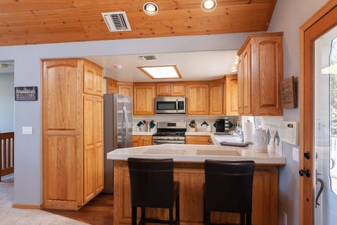 Well-stocked with standard items plus crock pot, rice cooker, blender, mixer.