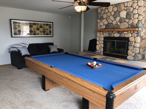 The game room is a perfect area for kids to gather while adults  enjoy upstairs.