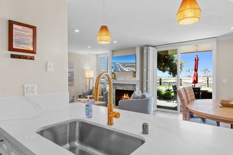 Cook with ease while staying connected to the dining and living areas with views that stretch out to the patio