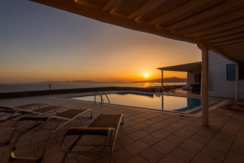 An infinity pool, sun loungers