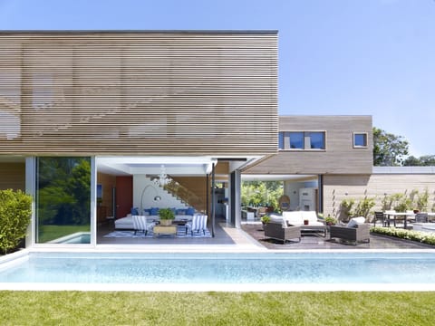 Glass walls disappear to allow the ultimate in indoor/outdoor living!