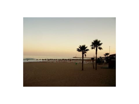 On the beach, sun loungers, beach towels