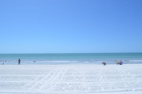 On the beach, sun loungers, beach towels