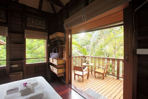 Guest Wing bedroom with storage baskets and clothing rod.