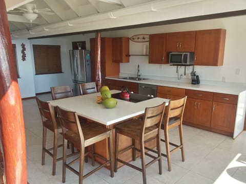 Fully sheltered indoor/outdoor kitchen