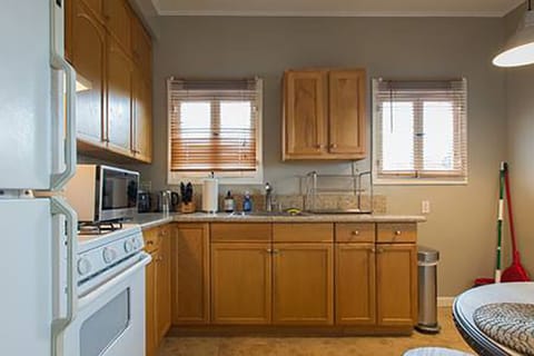 Fully equipped kitchen, stove, refrigerator, pans & pots, utensils, coffee maker