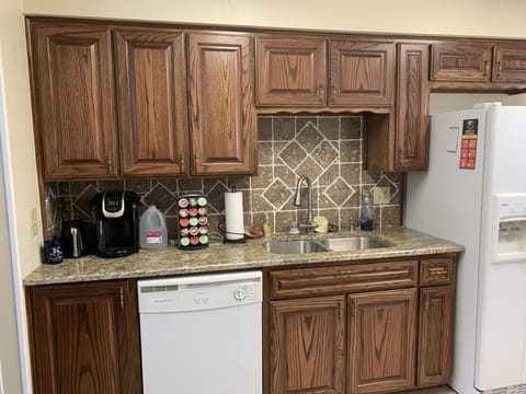 kitchen includes dishes, silverware, pots and pans and appliances