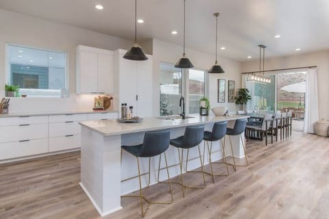 Kitchen/ dining area with sliding door to back patio/pool area