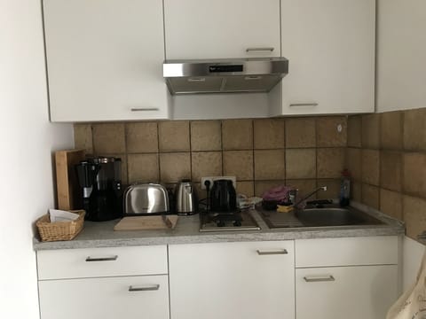 Fridge, coffee/tea maker, cookware/dishes/utensils