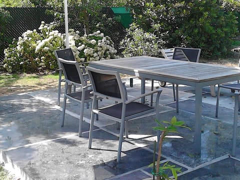 big terrace with umbrella, garden furniture