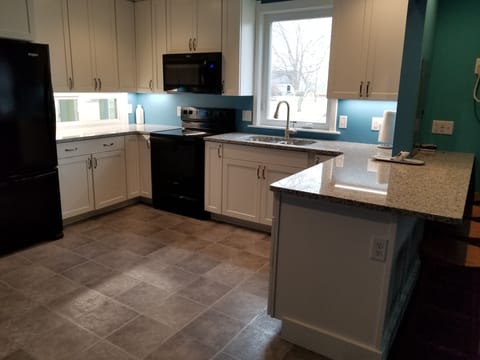 Large well stocked Kitchen.