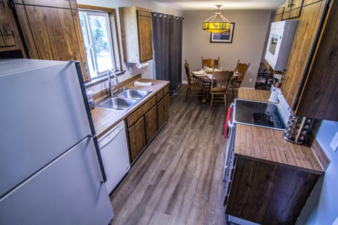 Kitchen: Full fridge, dishwasher, coffee bar area with coffee, sugar, tea, etc.