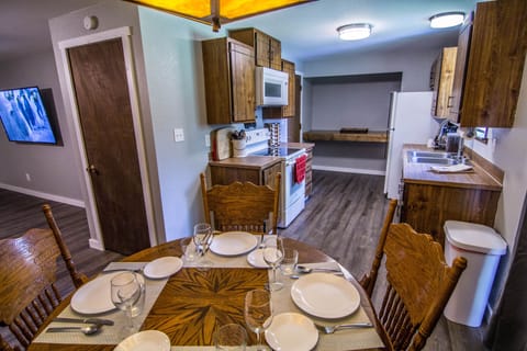 Dining Room: Table for 4 (expansion leaf under bed). Full Kitchen.