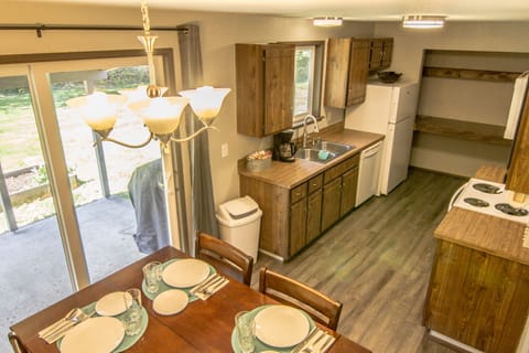 Pub height dining table (built in expansion leaf). Full Kitchen.