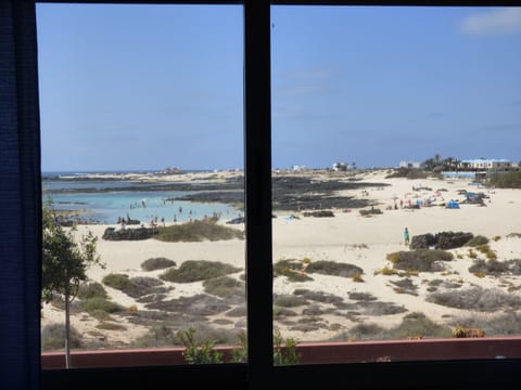 On the beach, sun loungers, beach towels