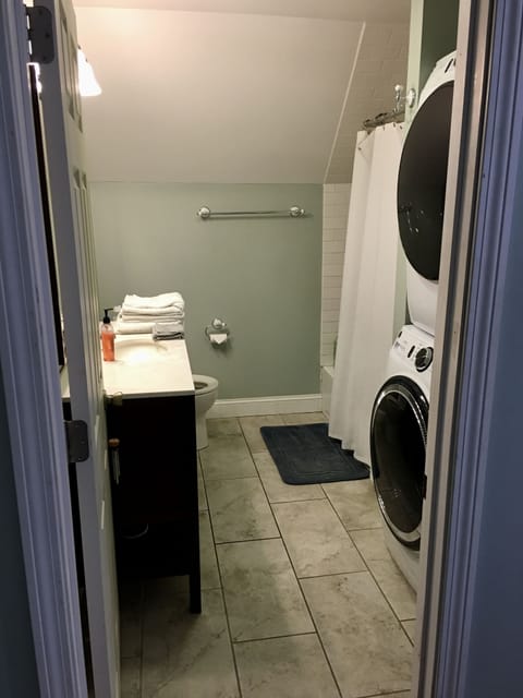 Combined shower/tub, hair dryer, towels, soap