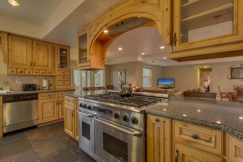 - Stainless steel double oven range
- Granite countertops and wood cabinets
- Fully stocked kitchen in mountain lodge
