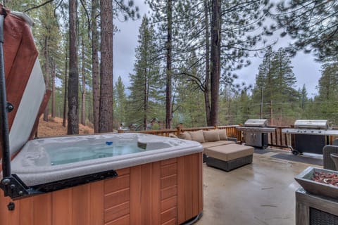 - Private hot tub on deck with forest views
- Cozy outdoor seating perfect for gatherings
- Lake Tahoe cabin rental with hot tub and grill space