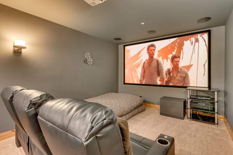 - Private theater room with big screen projector
- Reclining chairs and cozy setup for movie nights
- Tahoe vacation rental with home cinema experience