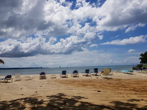 On the beach, sun loungers, beach towels