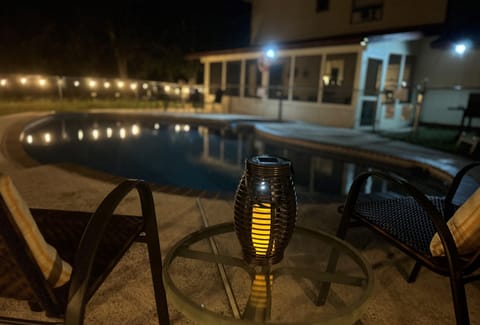 Imagine yourself on a wooded lot relaxing by the pool!