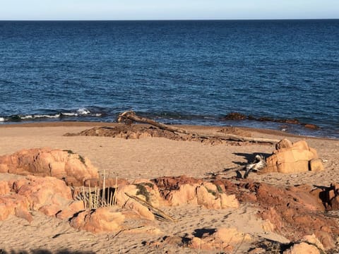 On the beach, sun loungers