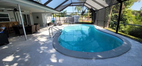 Outdoor pool, a heated pool, pool umbrellas