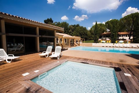 Lounge by the outdoor pool in the sunshine.