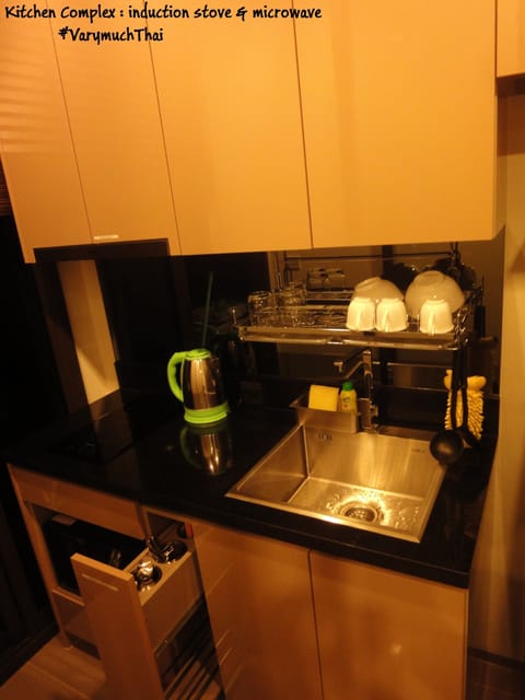 Fridge, microwave, coffee/tea maker, cookware/dishes/utensils