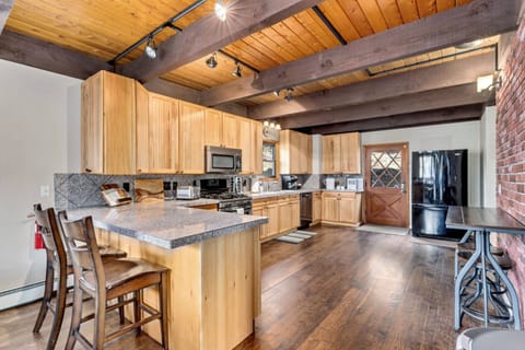 The kitchen has new and updated features, including dishwasher, refrigerator, plates and cutlery.