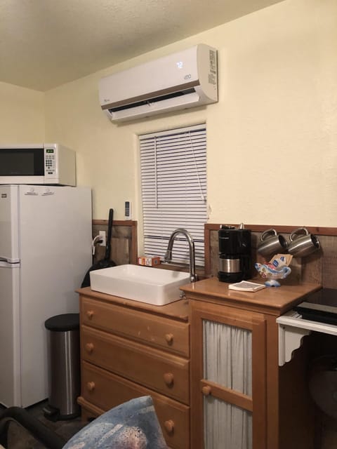 Fridge, microwave, stovetop, coffee/tea maker