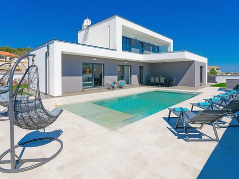 Sky, Property, Furniture, Building, Window, Swimming Pool, Blue, Azure, Shade, Outdoor Furniture