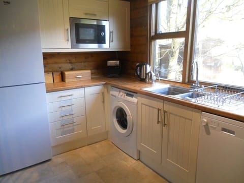 Full amenities and overlooking river with adjacent dining area.