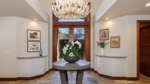 A beautiful coral inspired chandelier welcomes you