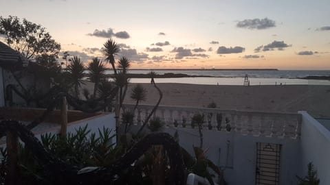 On the beach, sun loungers, beach towels