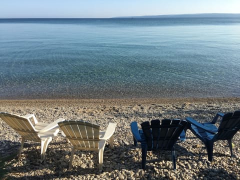 On the beach, sun loungers, beach towels