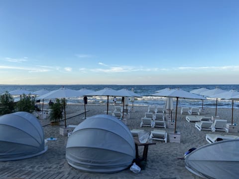 On the beach, sun loungers, beach towels