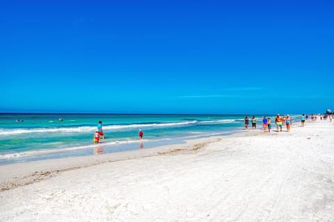 On the beach, sun loungers, beach towels