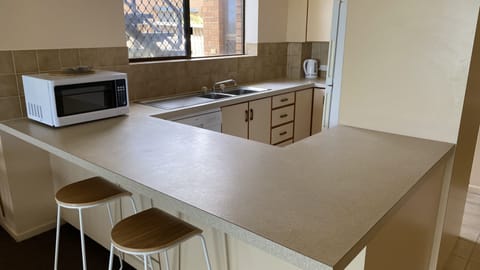 Fridge, microwave, dishwasher, dining tables