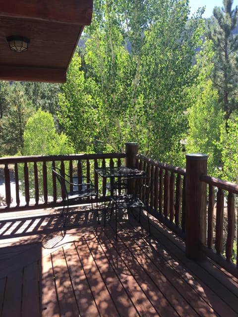Sunny front porch with small table and chairs