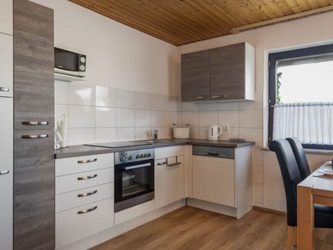 Cabinetry, Countertop, Furniture, Kitchen Stove, Kitchen, Sink, Building, Wood, Kitchen Appliance, Window