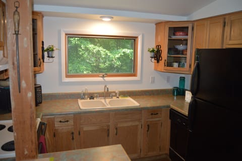 Full kitchen with plenty of cabinet space and many conveniences
