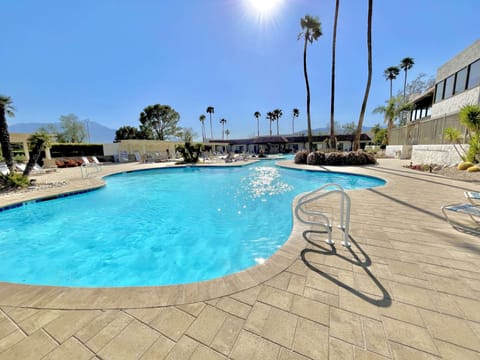 Enjoy the huge HEATED clubhouse pool with 2 hot tubs + snack bar