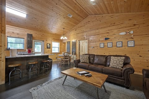 The living room opens to the dining area and kitchen with bar seating.