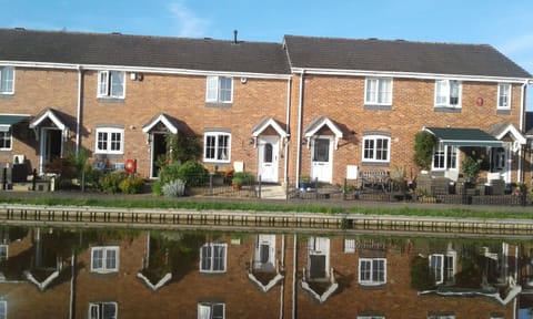 Looking at No. 5 Waterside Drive with the white door from other side of canal.