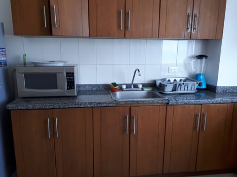 Fridge, oven, coffee/tea maker, cookware/dishes/utensils