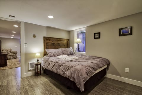 Here is a queen bed in 1 of the 3 bedrooms downstairs