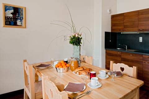 Prepare meals in the kitchenette and enjoy them at the dining table.